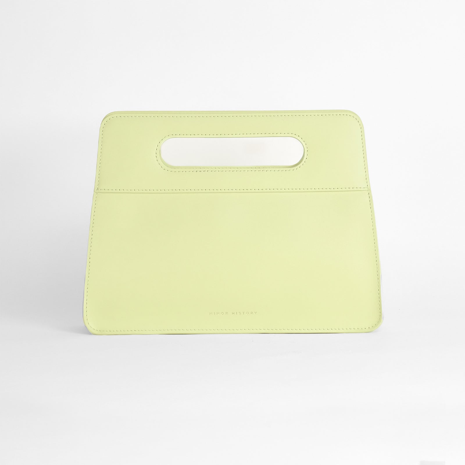 Afterparty Clutch in Limelight green leather - vibrant studio setting