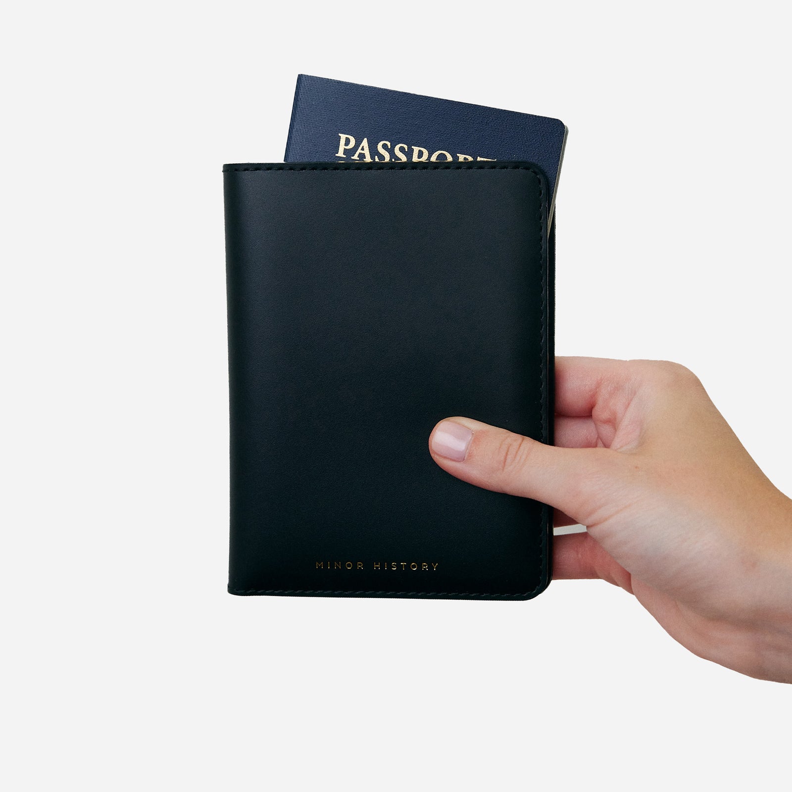 Atlas passport holder in black full-grain leather, minimalist travel wallet for passports and essentials