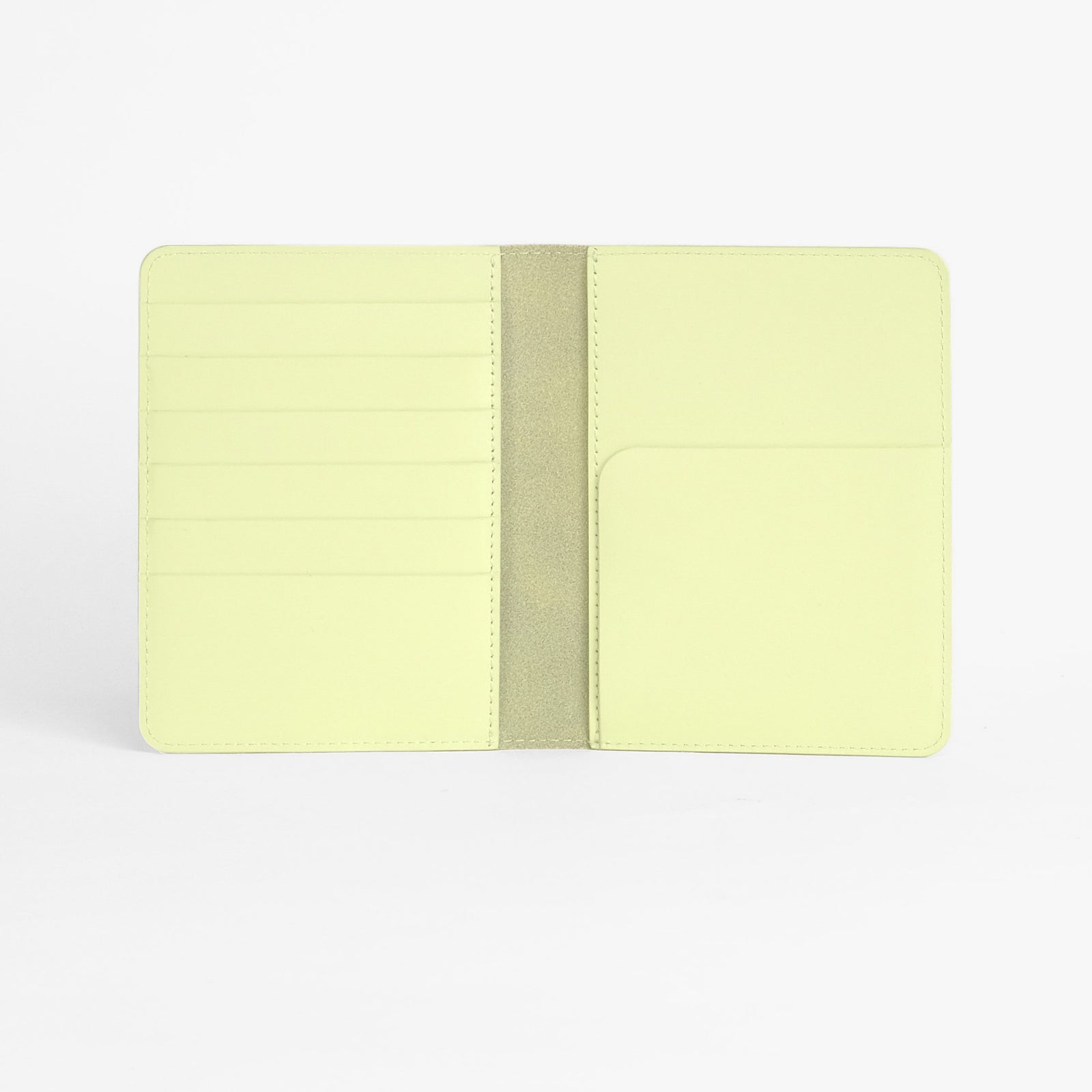 Atlas passport holder in limelight green full-grain leather, front view in bright studio setting