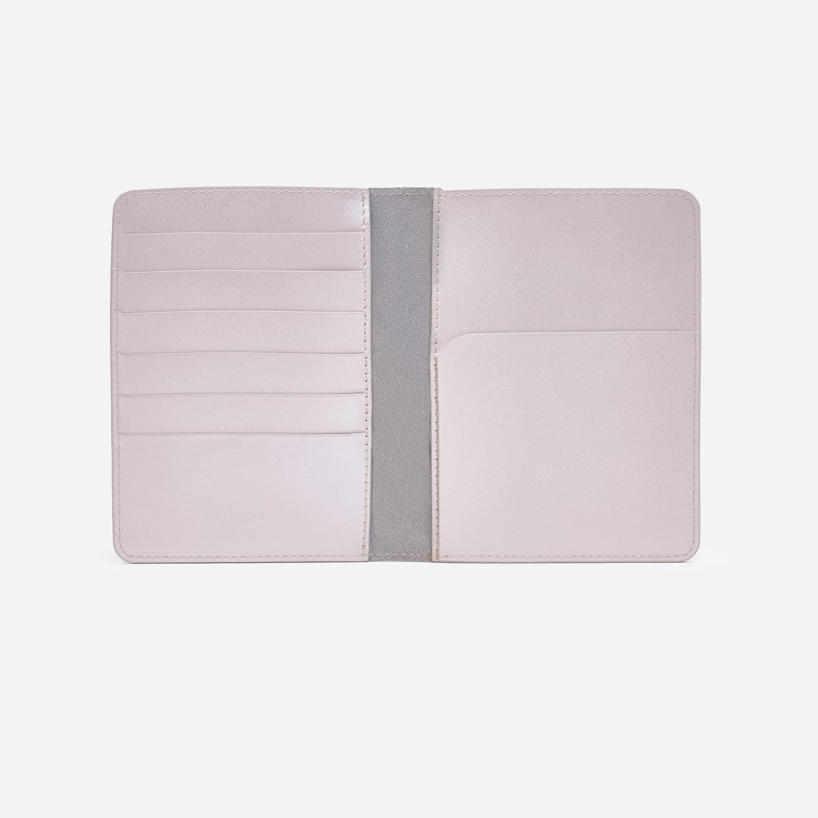 Atlas passport holder in pearl white full-grain leather, front view in bright studio setting