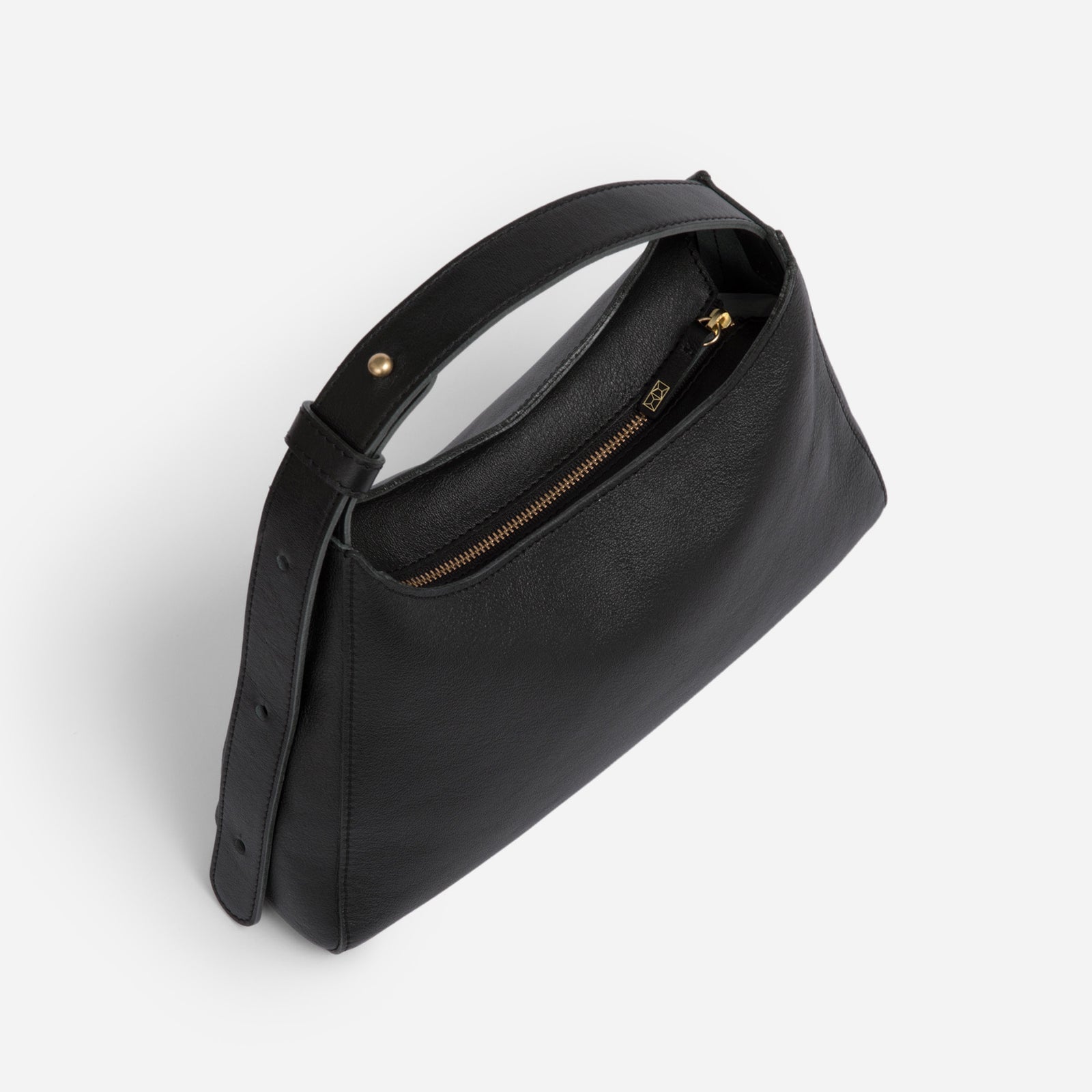 Black Overtime Tote Bag front view highlighting brass hardware