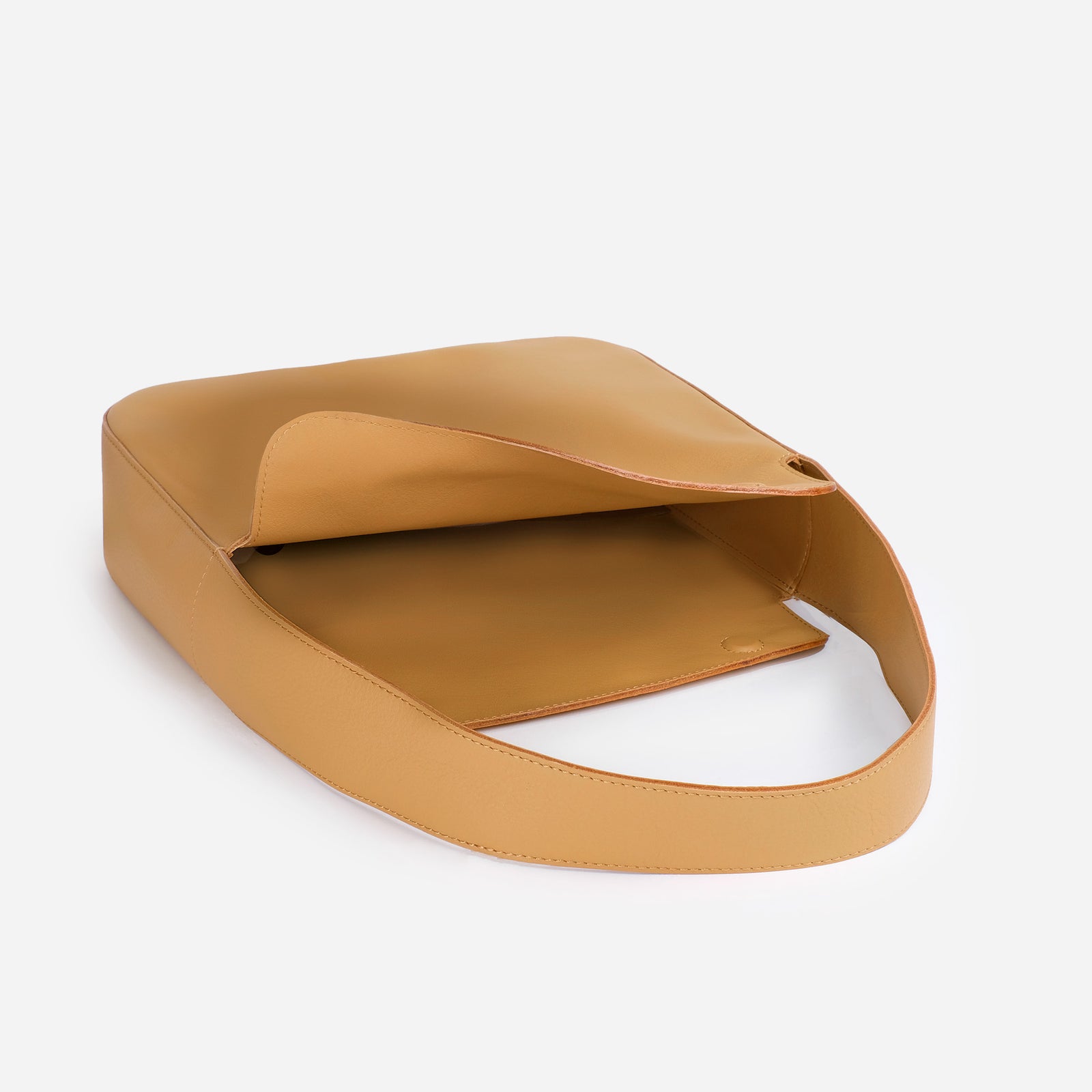 Frame Bag in saddle brown full-grain leather, detailed studio shot capturing texture and strap design