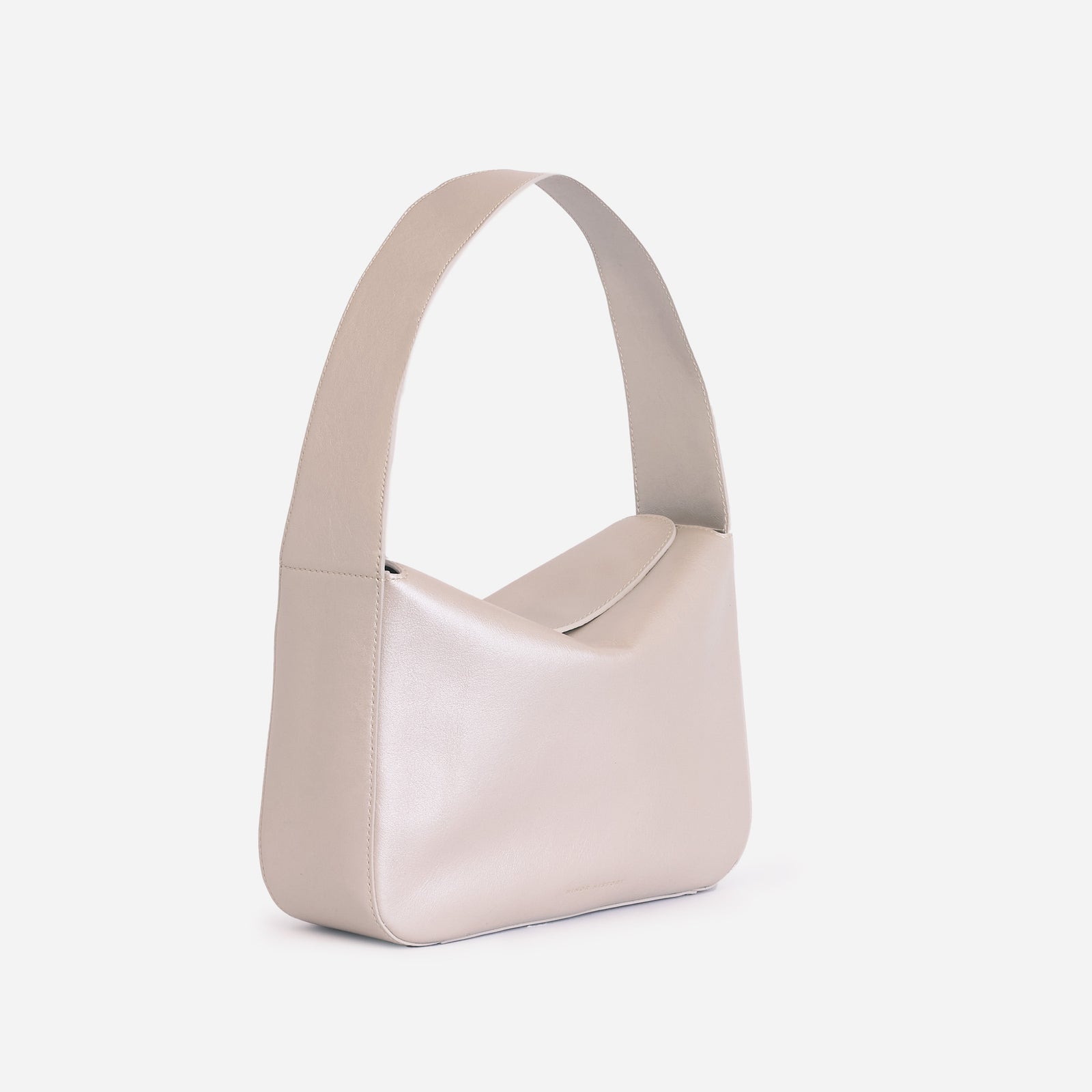 Frame Bag in pearl full-grain leather, styled as a shoulder bag with soft folds