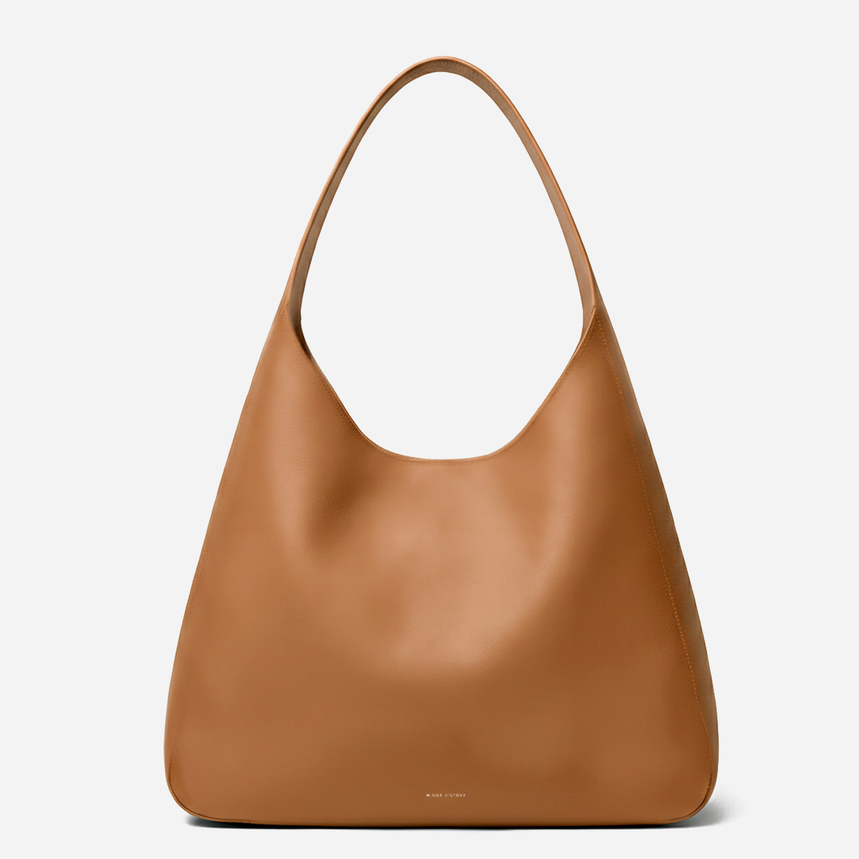 Brown leather handbag on a light gray background - Saddle