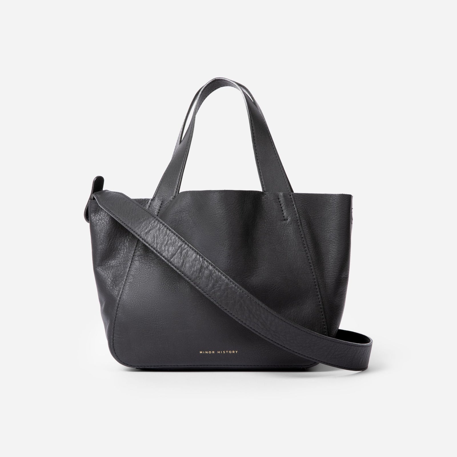 Black handbag with a shoulder strap on a white background - Black