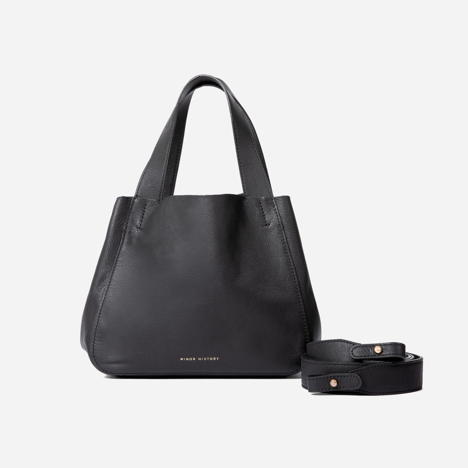 Black leather handbag with matching strap on a white background - Black