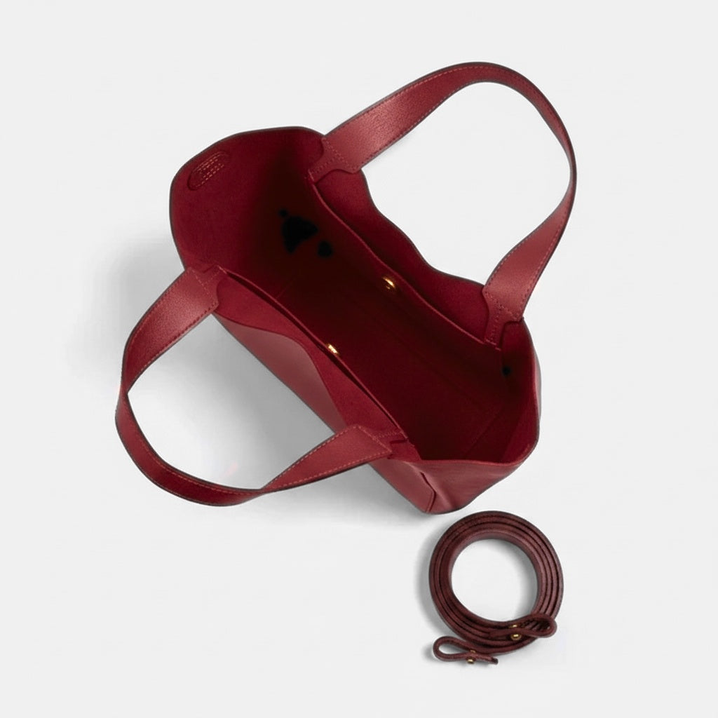 Red handbag with detachable strap on a light gray background - Cherry Cola