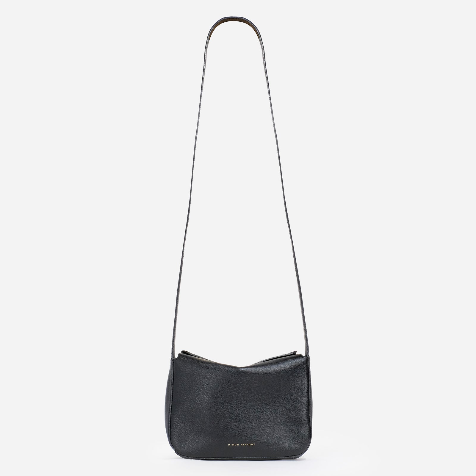 Little Frame crossbody bag in black full-grain leather, front view against a light background, minimalist women's handbag