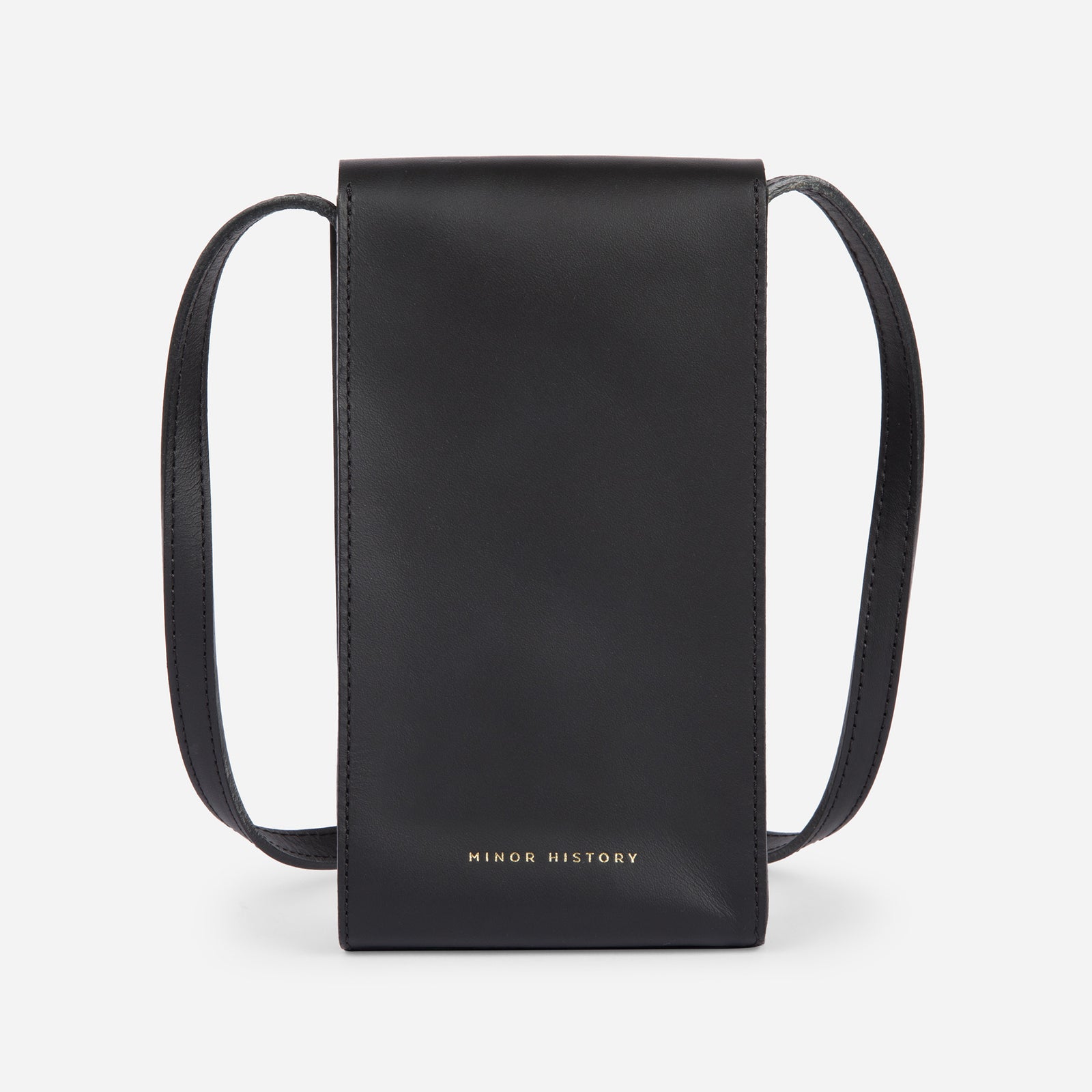 Mini Bandit crossbody bag in black full-grain leather, angled side view showing strap and shape