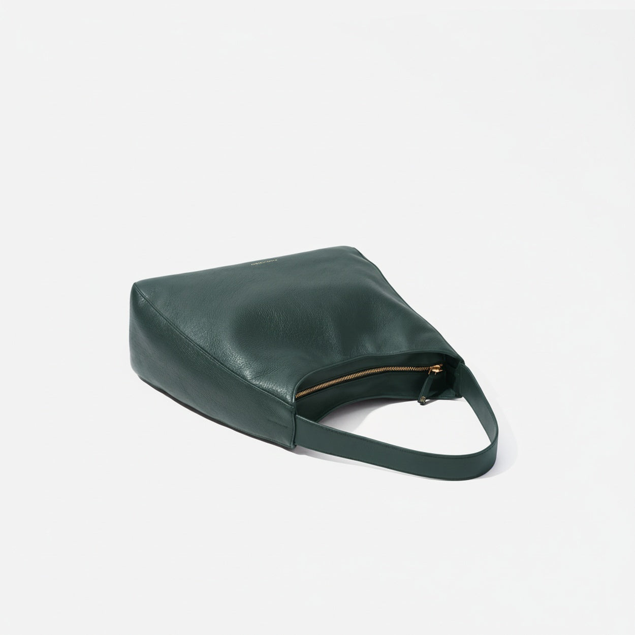 Green handbag on a light gray background -Evergreen