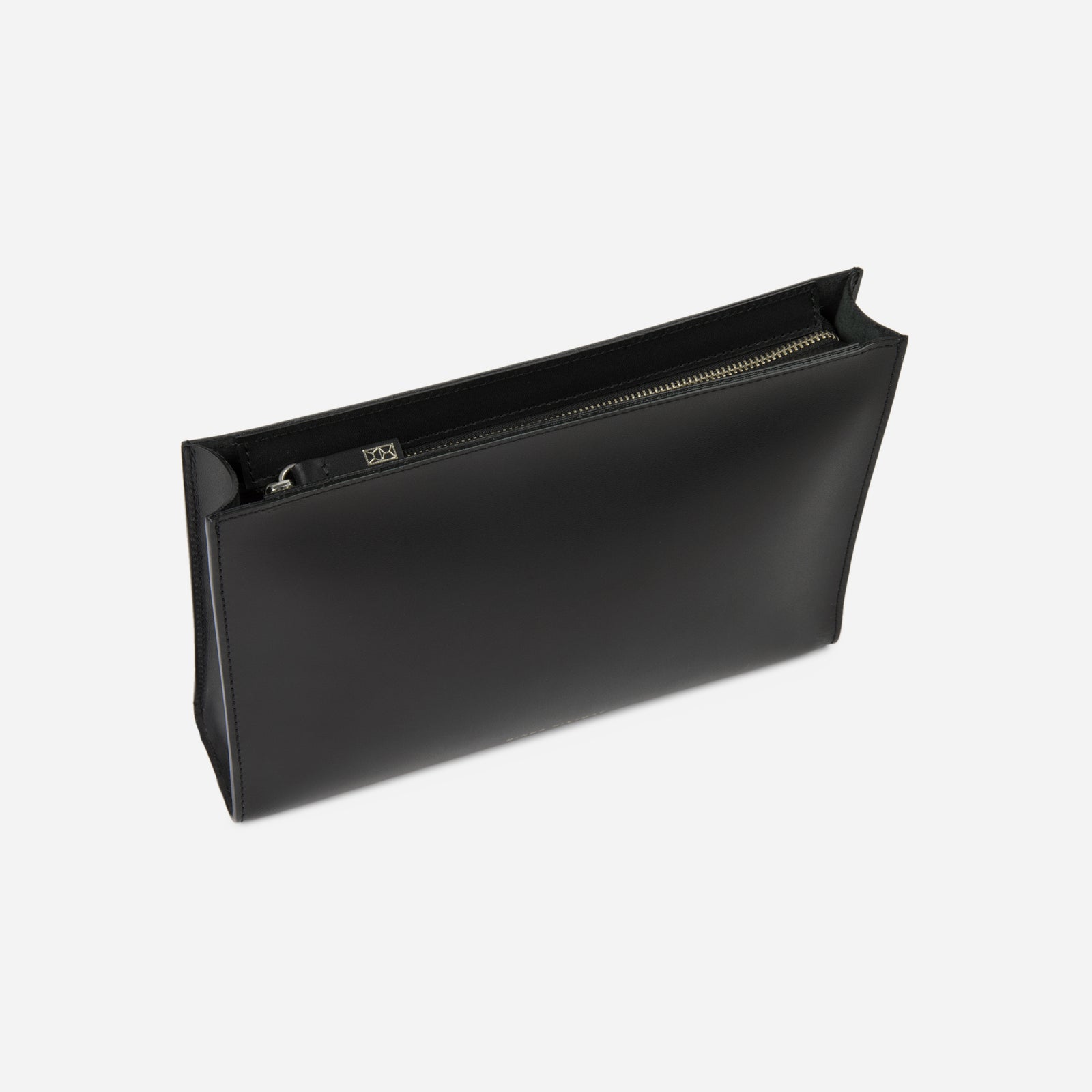 Close-up studio shot of Minor History leather accessory