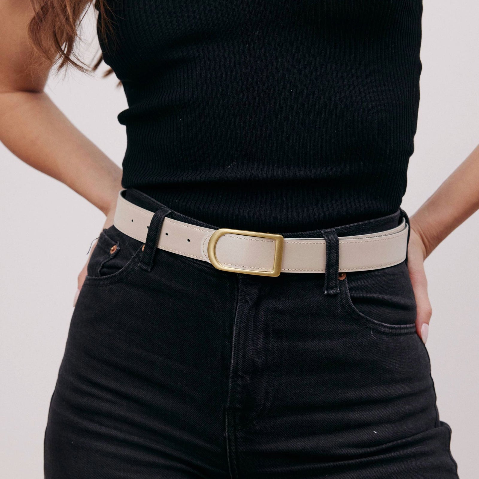 Gemini reversible belt in black full-grain leather with brass buckle, minimalist fashion accessory for everyday wear