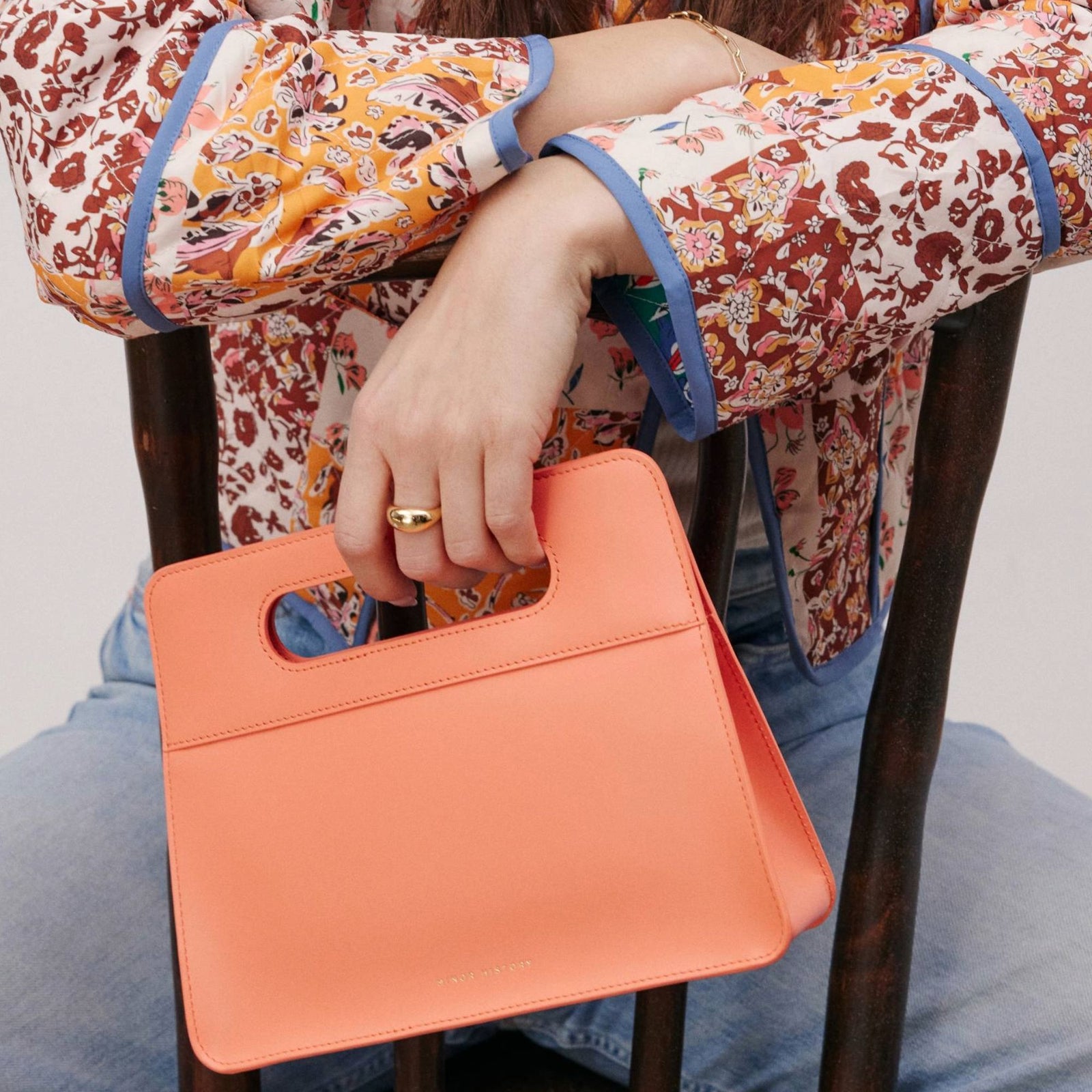 Lifestyle brand image with Minor History handbag in soft lighting