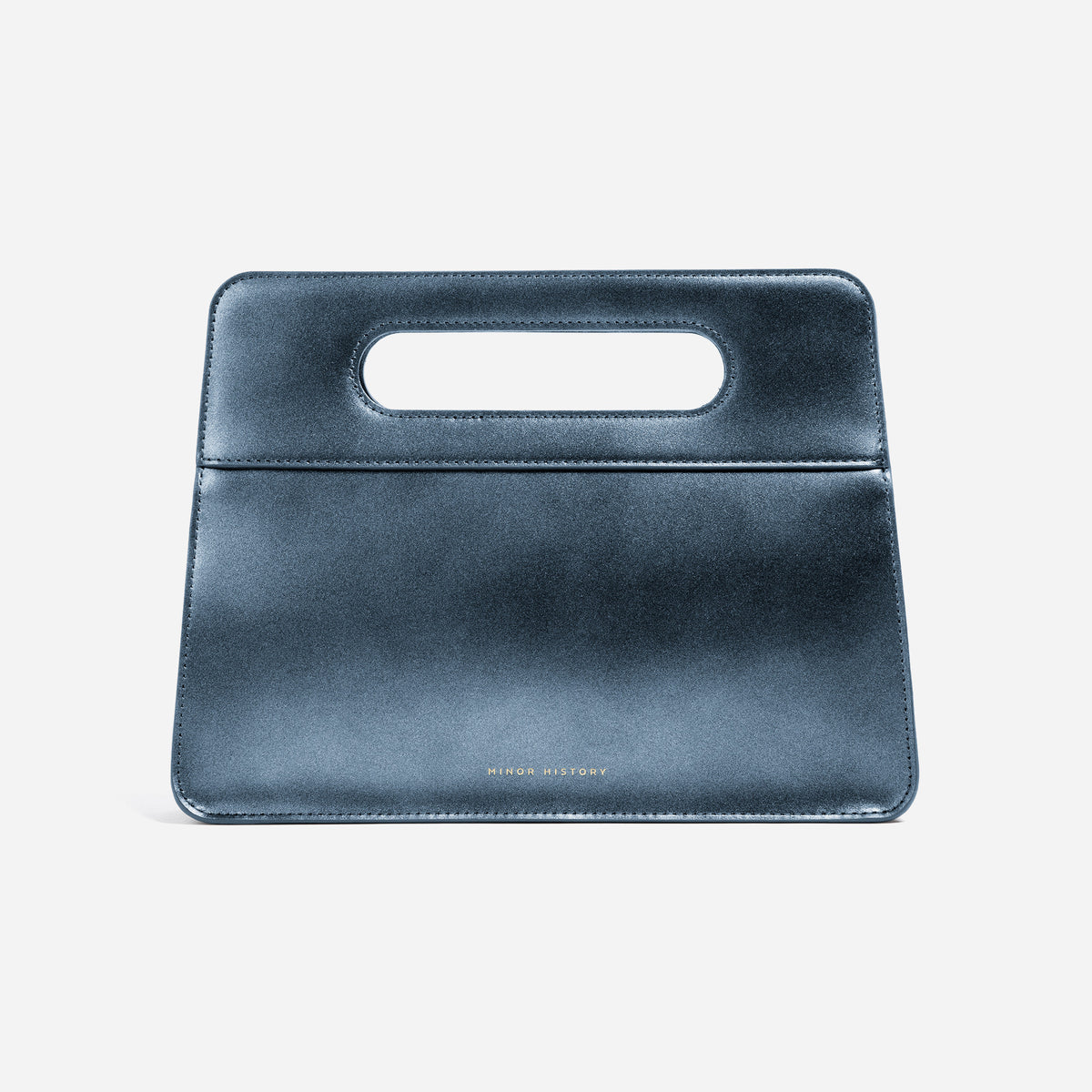 Afterparty Clutch in Jet black leather - angled lifestyle view