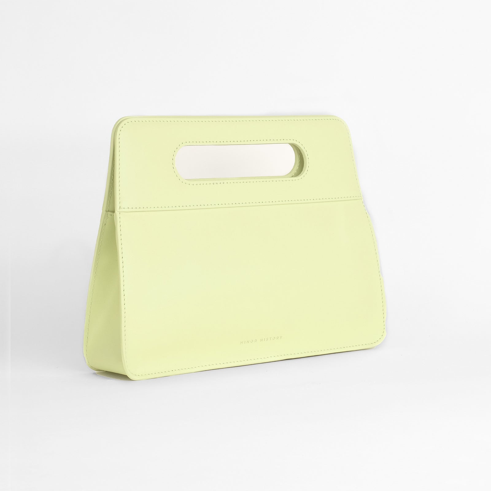 Limelight Afterparty Clutch - side profile with brass hardware detail