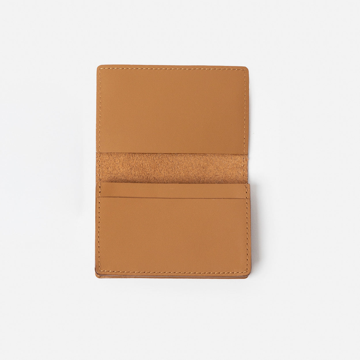 Brown leather wallet on a white background - Saddle