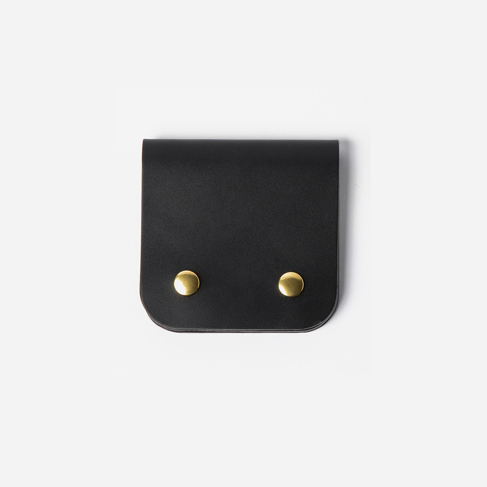 Black leather pouch with gold studs on a white background - Black