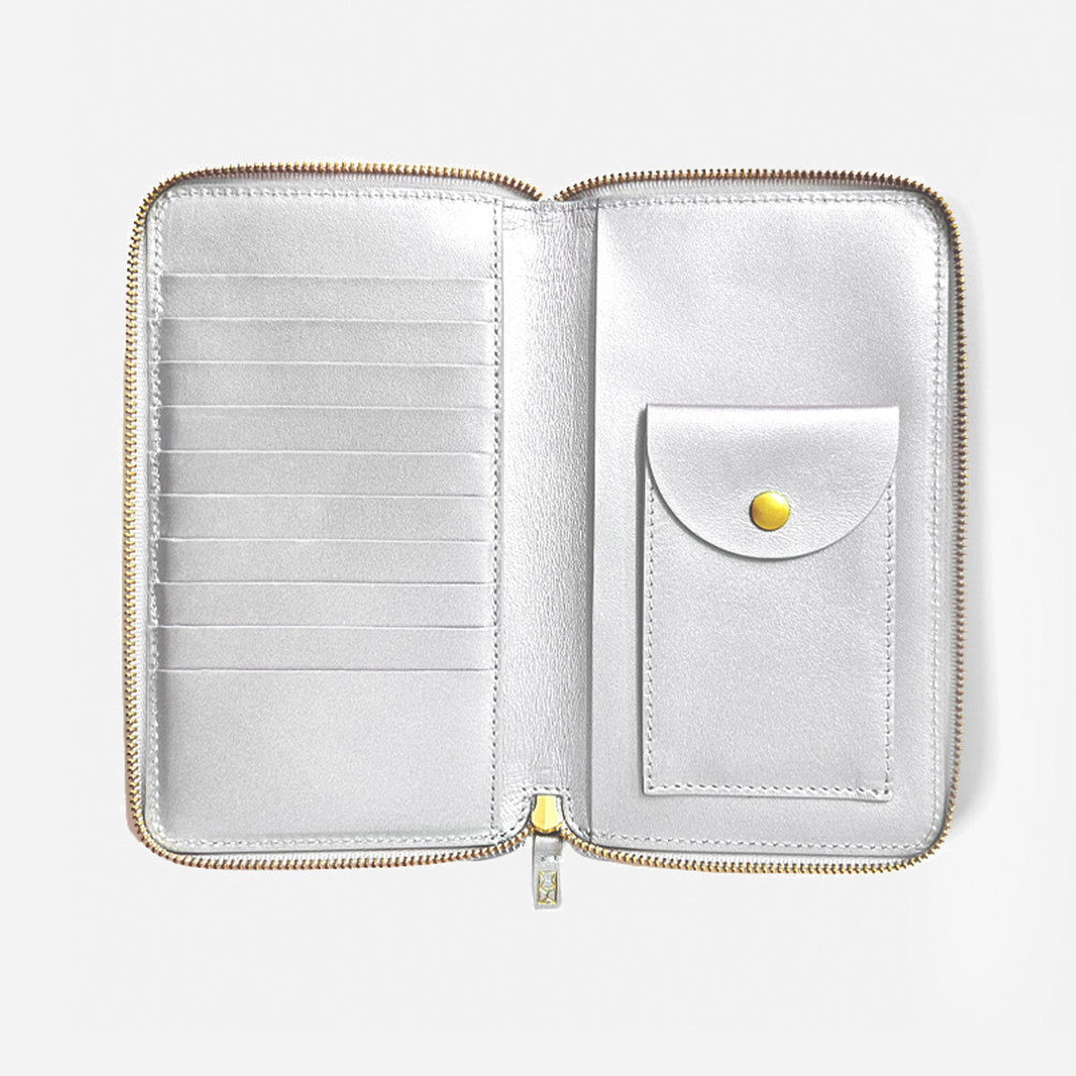 White zippered wallet with a pocket and gold accents on a white - background - Sterling