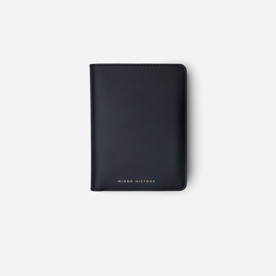 Black Atlas Passport Case, closed front view showing the stitched edges - Black