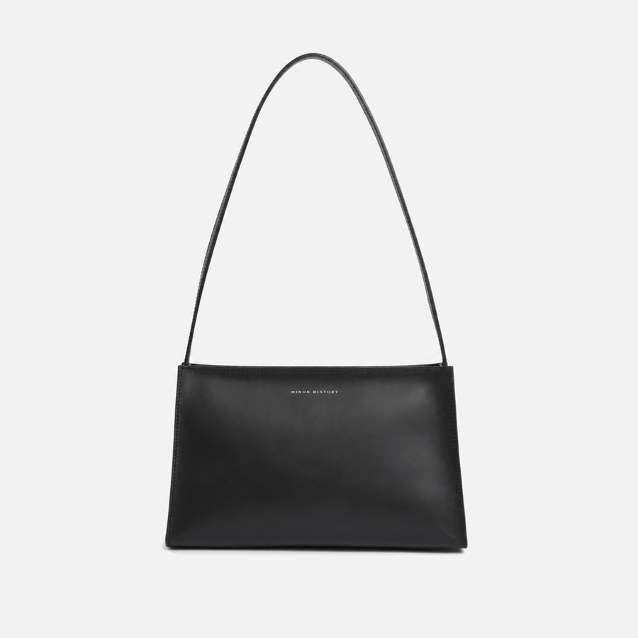 Black Line Shoulder Bag, front view showing the slim shoulder strap and rectangular body - Black