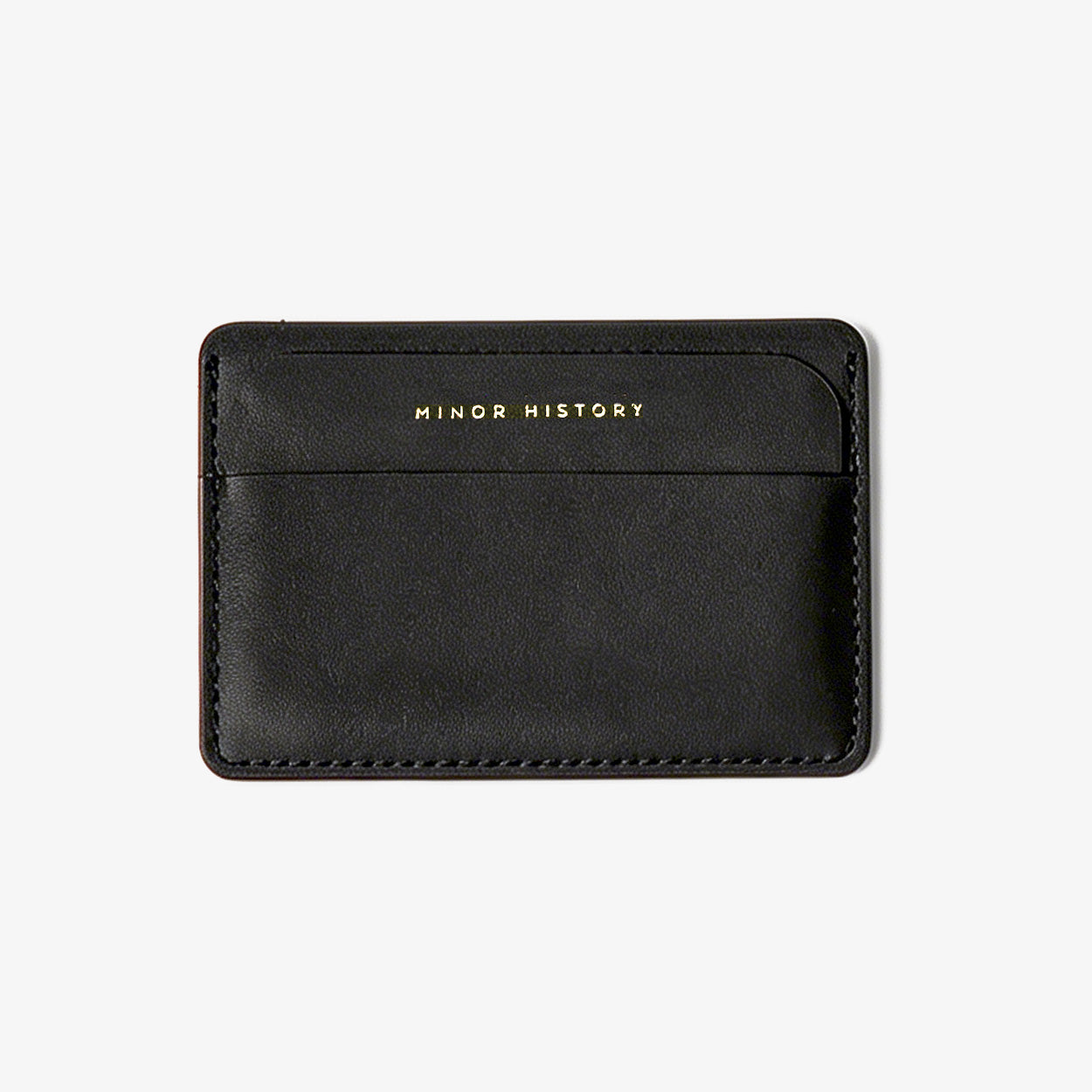 Gold cardholder with 'Ninety History' branding on a white background - Golden