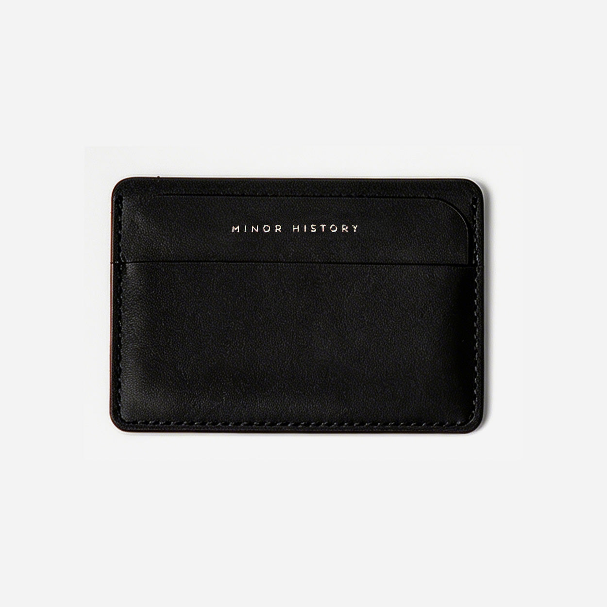 Black cardholder with 'MINOR HISTORY' branding on a light gray background - Black