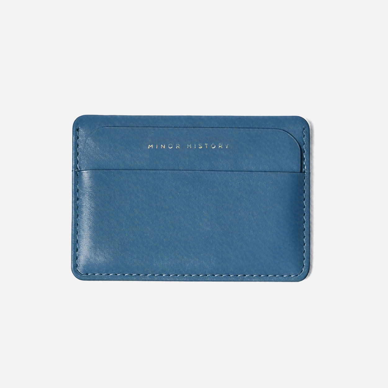 Gold cardholder with 'Ninety History' branding on a white background - Golden