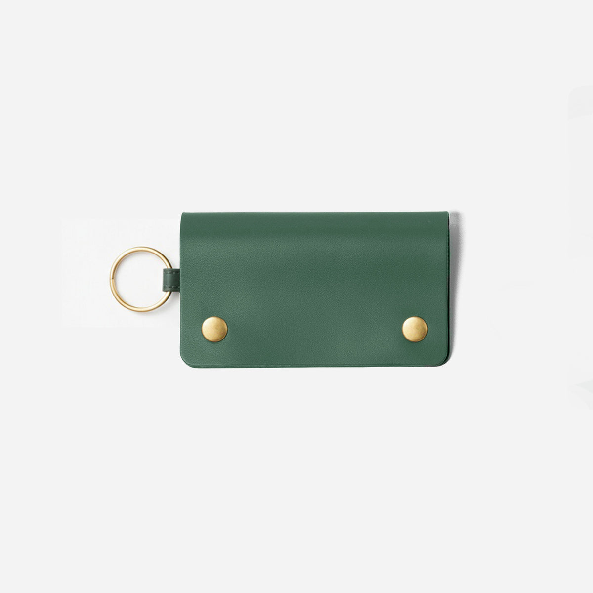 Green leather key holder with gold accents on a white background -Evergreen