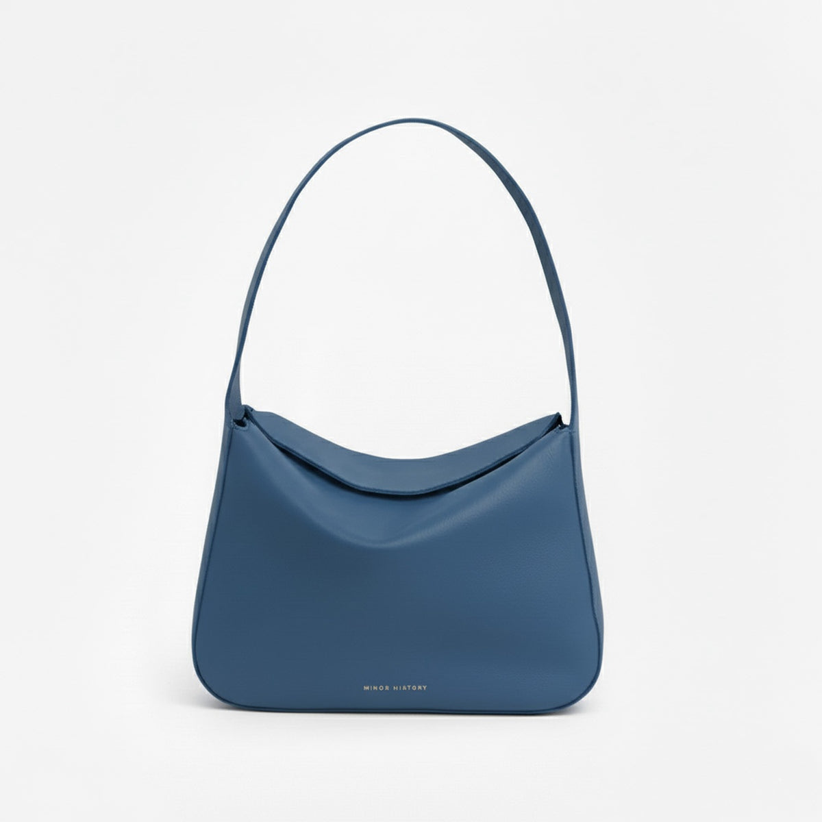 Blue handbag on a light gray background  - Chambray
