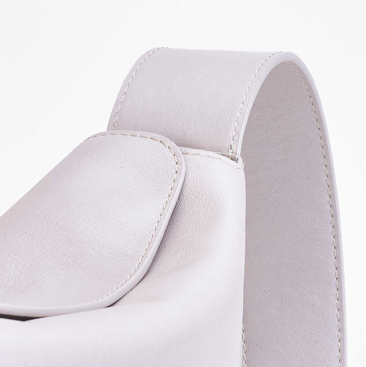 Frame Bag in pearl full-grain leather, detailed studio shot capturing texture and strap design