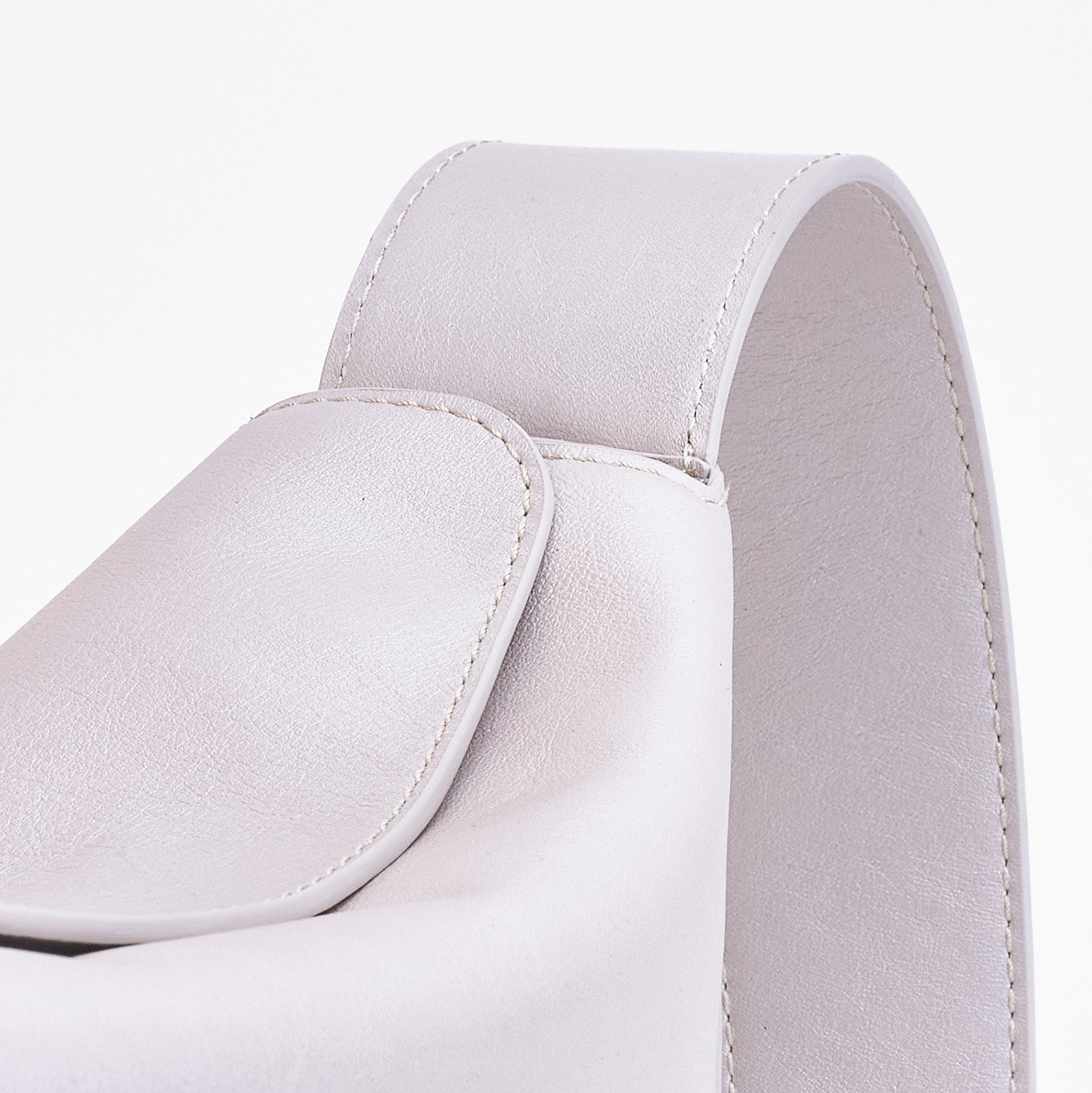 Frame Bag in pearl full-grain leather, detailed studio shot capturing texture and strap design