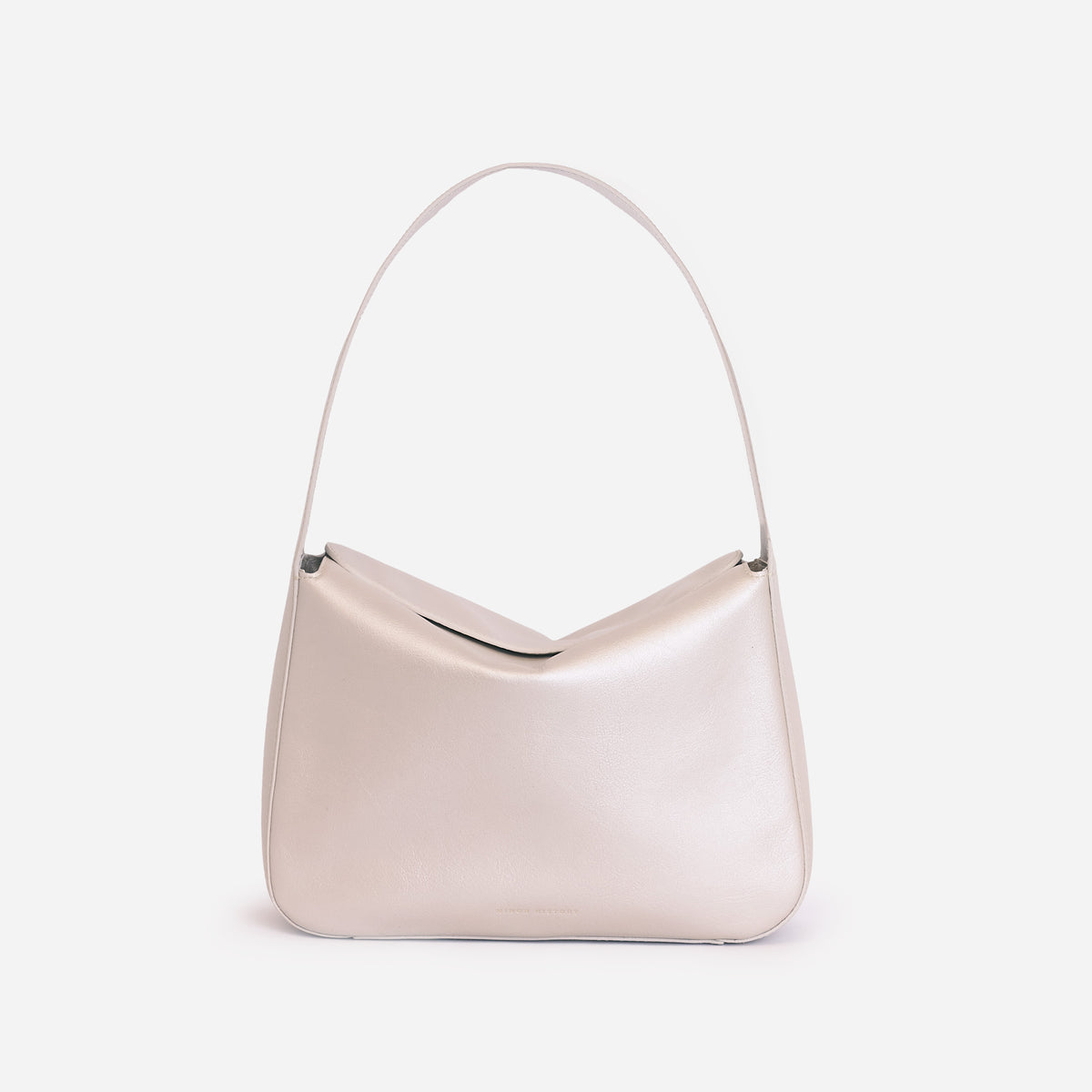 Frame Bag in pearl full-grain leather, styled as a shoulder bag with soft folds