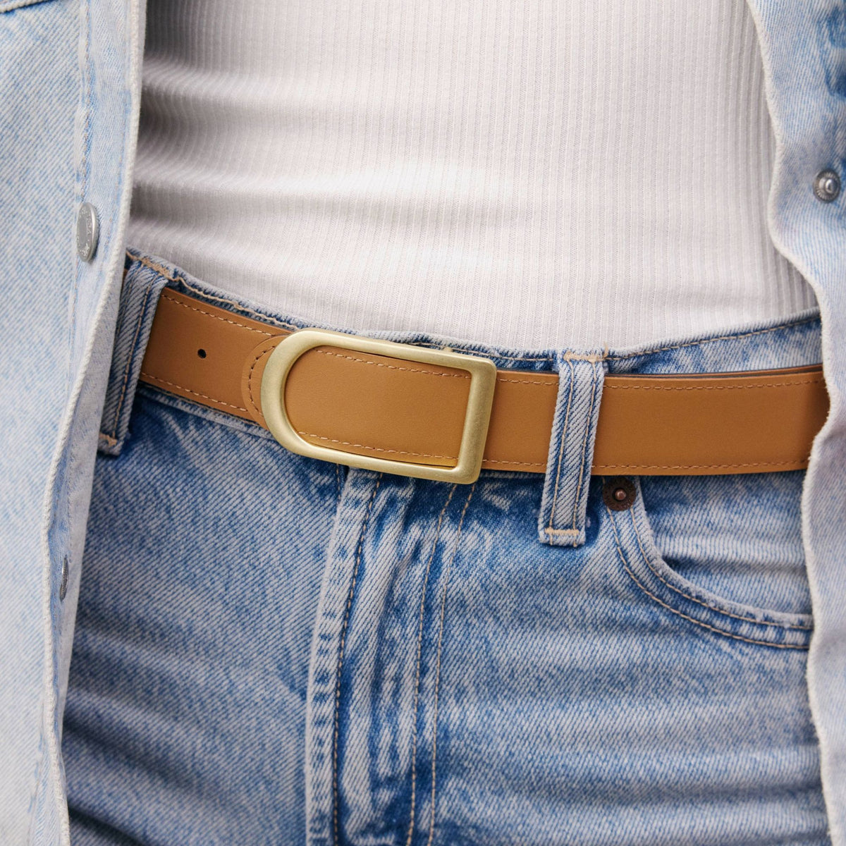 Gemini reversible belt in black full-grain leather with brass buckle, minimalist fashion accessory for everyday wear