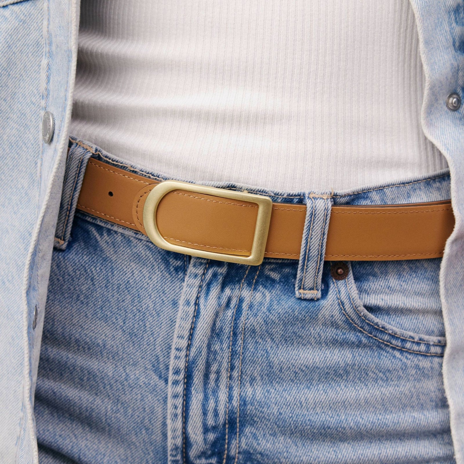 Gemini reversible belt in black full-grain leather with brass buckle, minimalist fashion accessory for everyday wear
