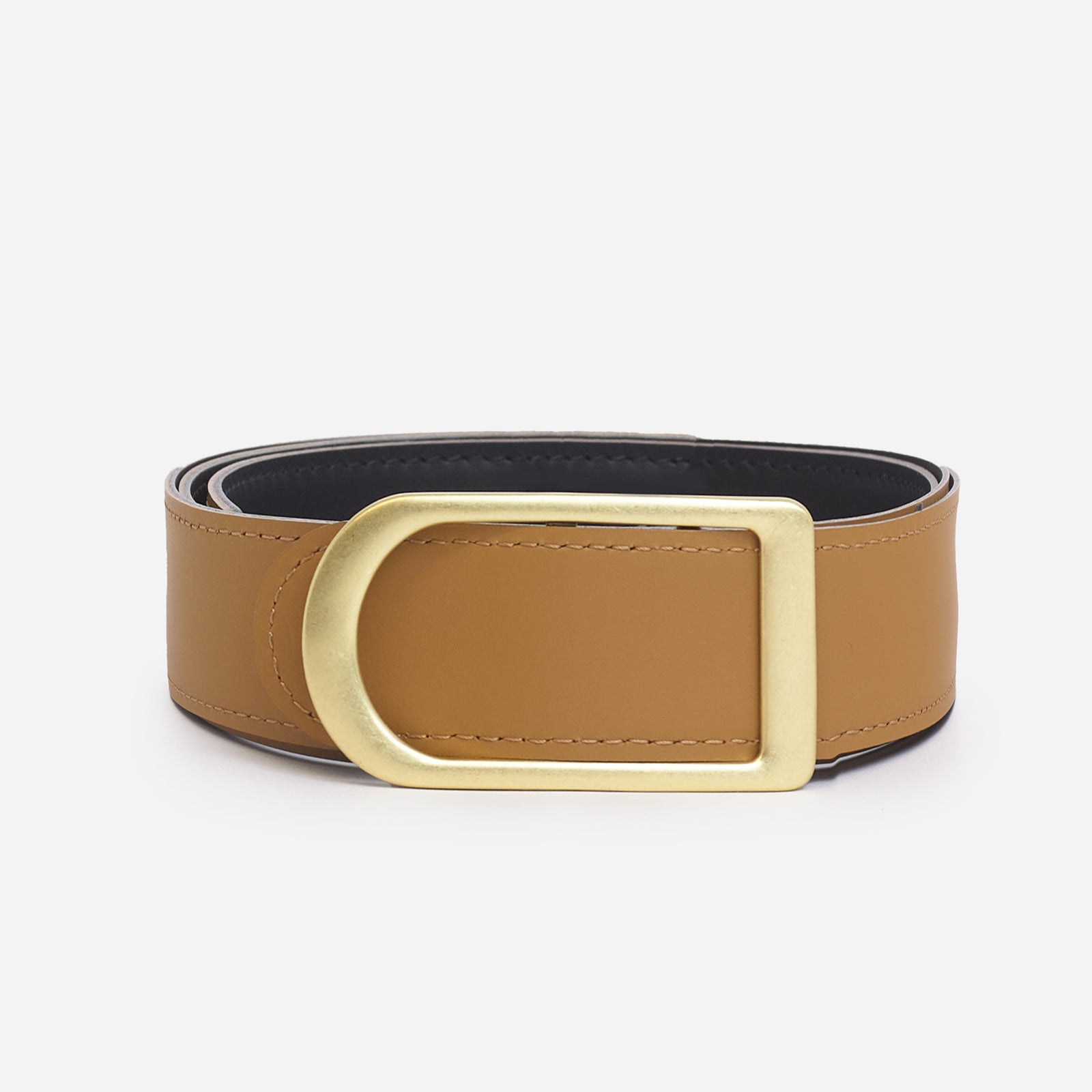 Gemini reversible belt in black and saddle brown full-grain leather with brass buckle, side view focusing on reversible color contrast