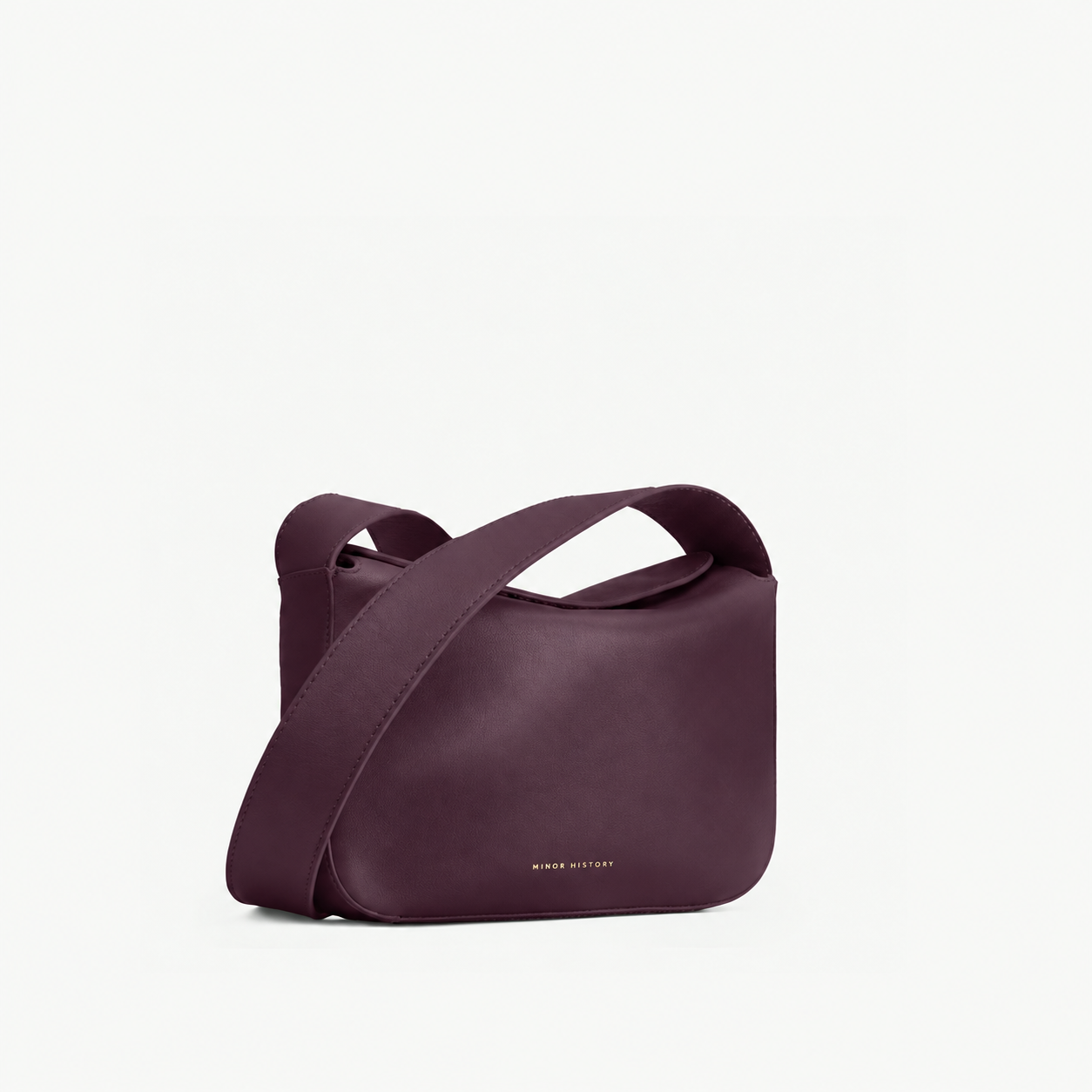 Little Frame crossbody bag in black full-grain leather, front view showcasing its sculpted shape, minimalist women's handbag - Black