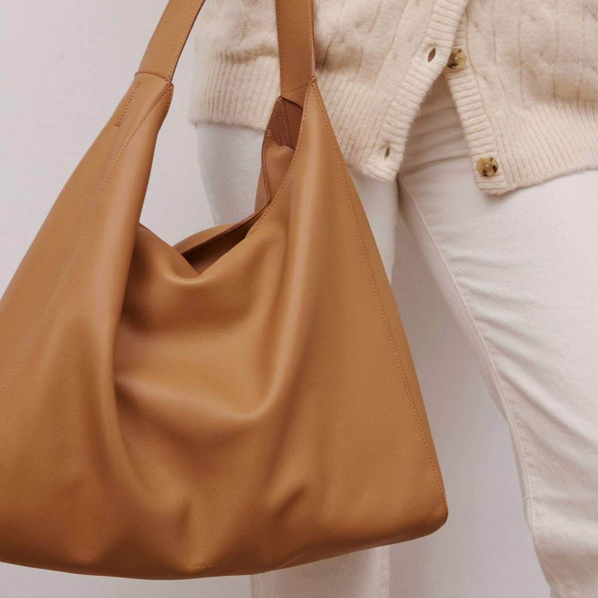 Overtime Tote in full-grain leather, lifestyle image styled with everyday outfit