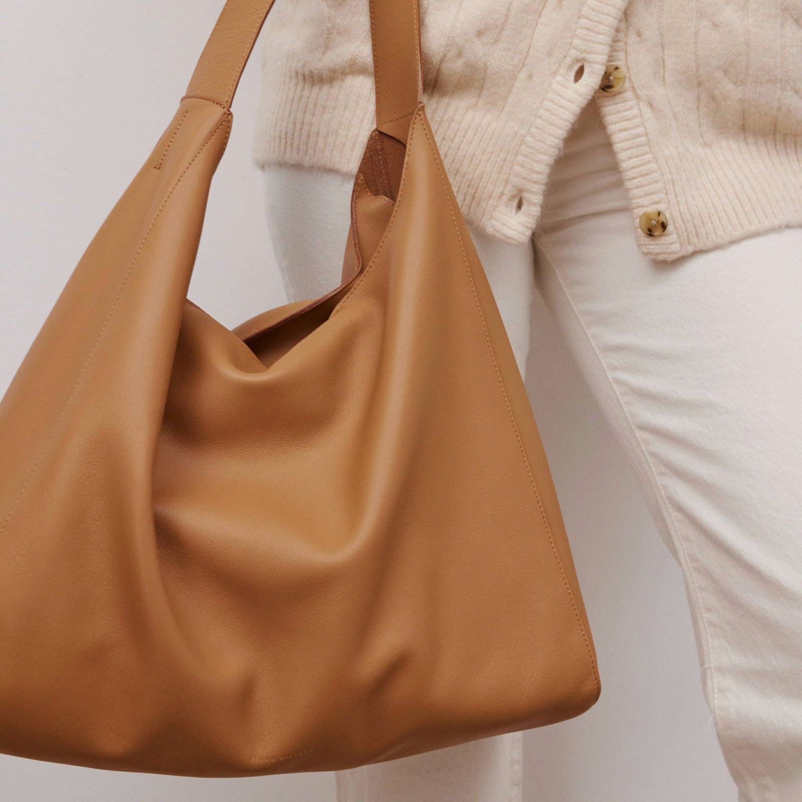 Overtime Tote in full-grain leather, lifestyle image styled with everyday outfit