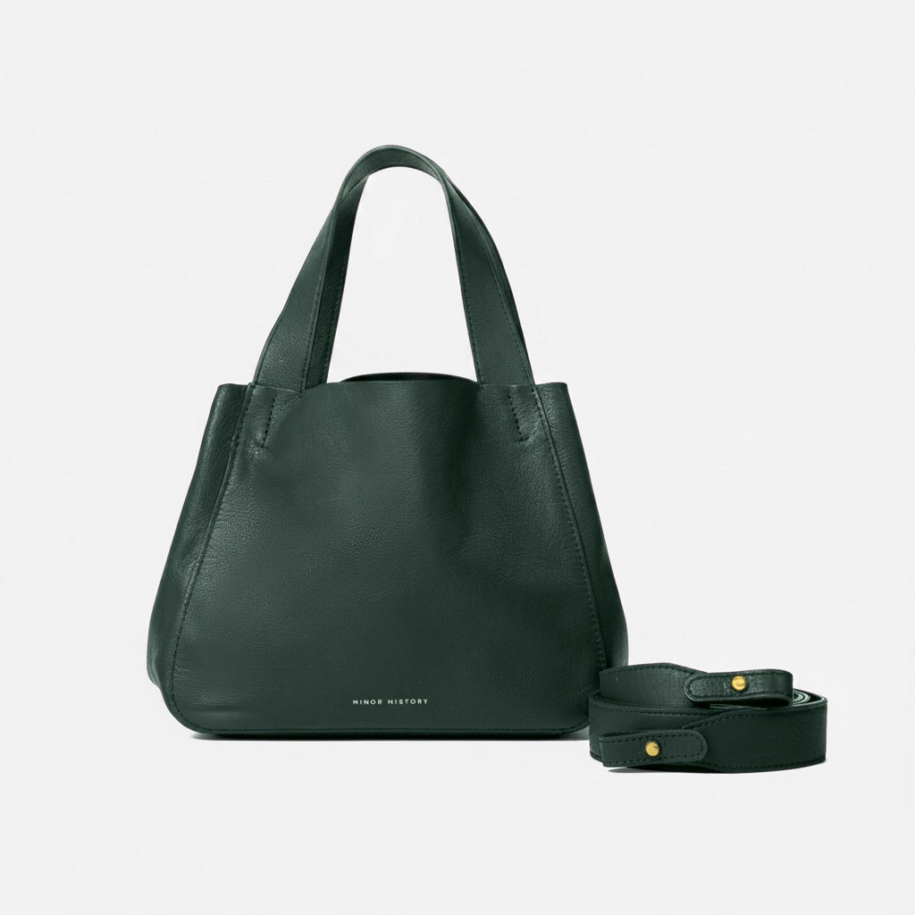 Green handbag with matching belt on a light gray background - Evergreen