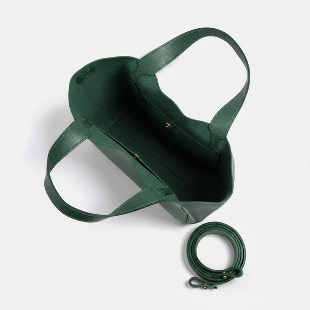 Green leather bag with matching strap on a white background - Evergreen
