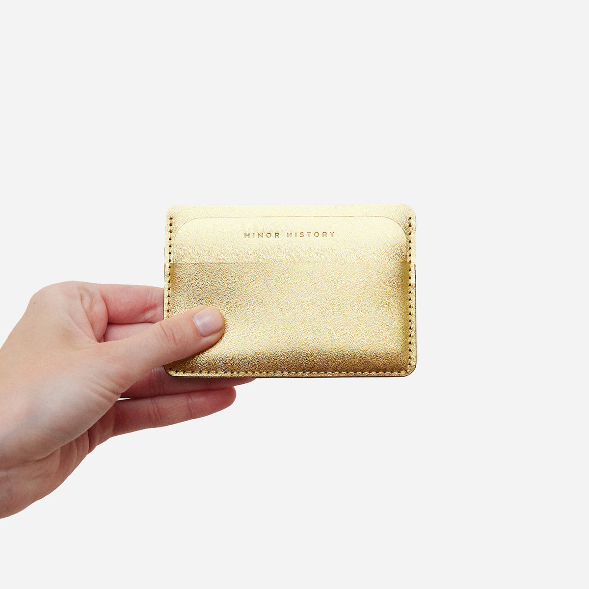 Metro Golden leather wallet with brass button detail