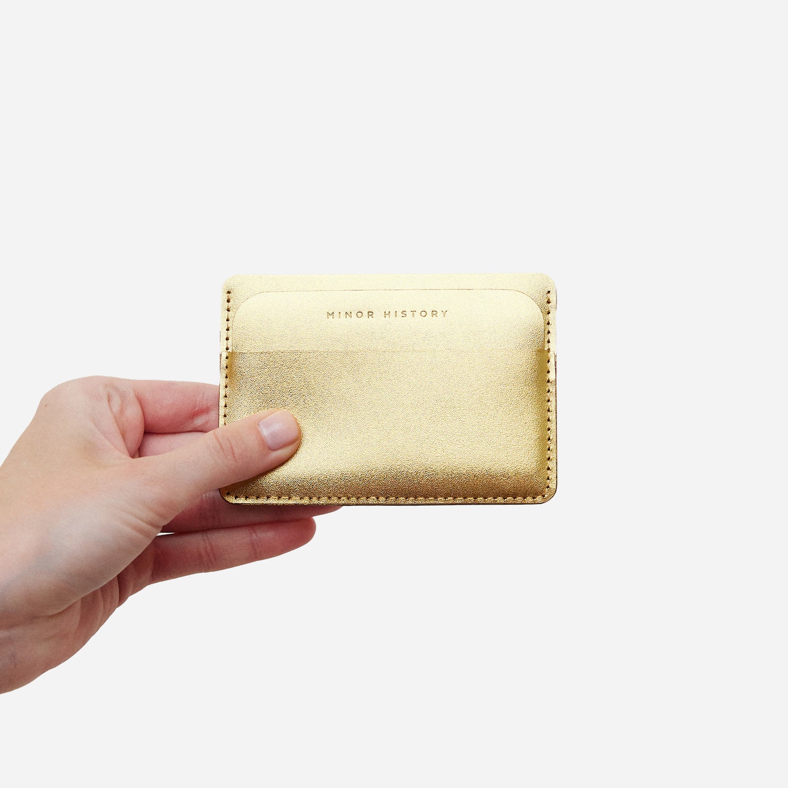 Metro Golden leather wallet with brass button detail