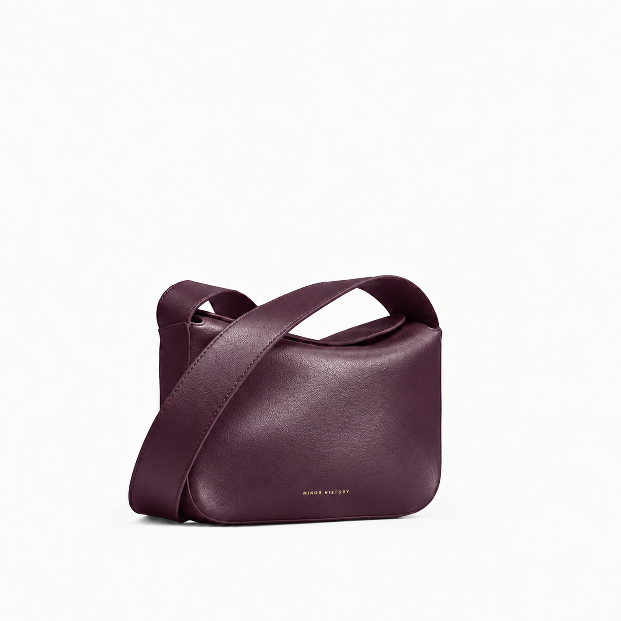 Black Little Frame Crossbody, angled front view with the strap draped across the bag - Black