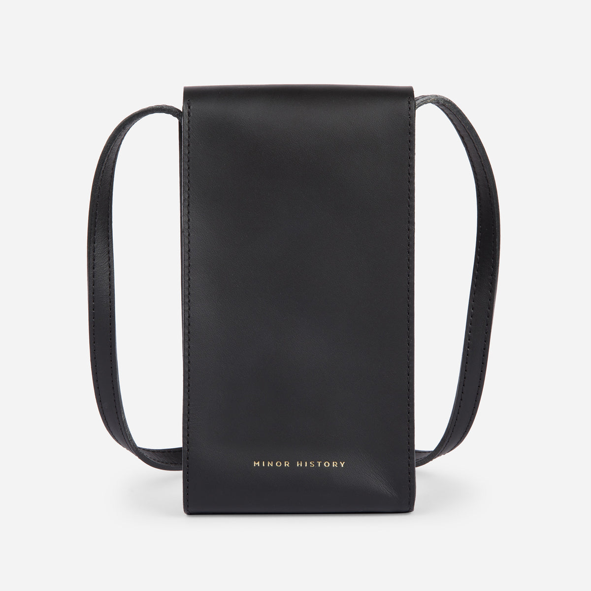 Mini Bandit crossbody bag in black full-grain leather, angled side view showing strap and shape