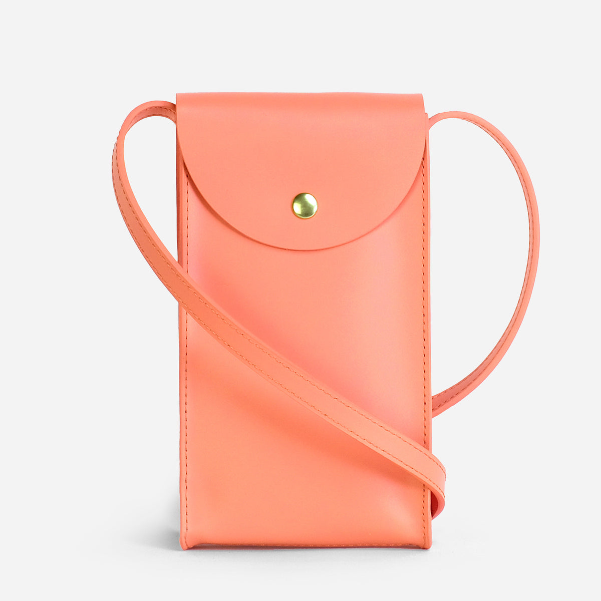 Mini Bandit crossbody bag in paloma pink full-grain leather, angled side view showing strap and shape
