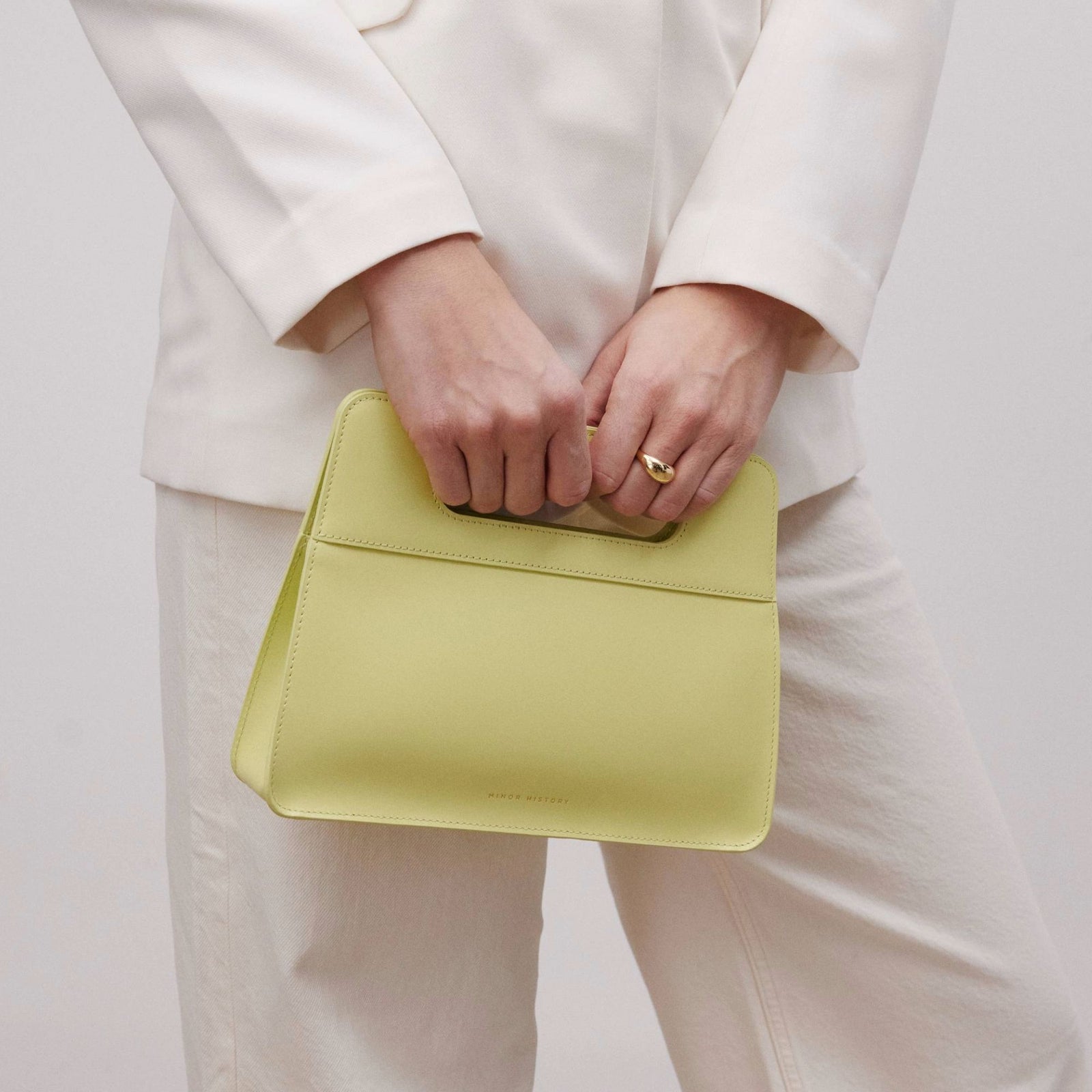 Creative close-up brand image with Minor History accessory focus