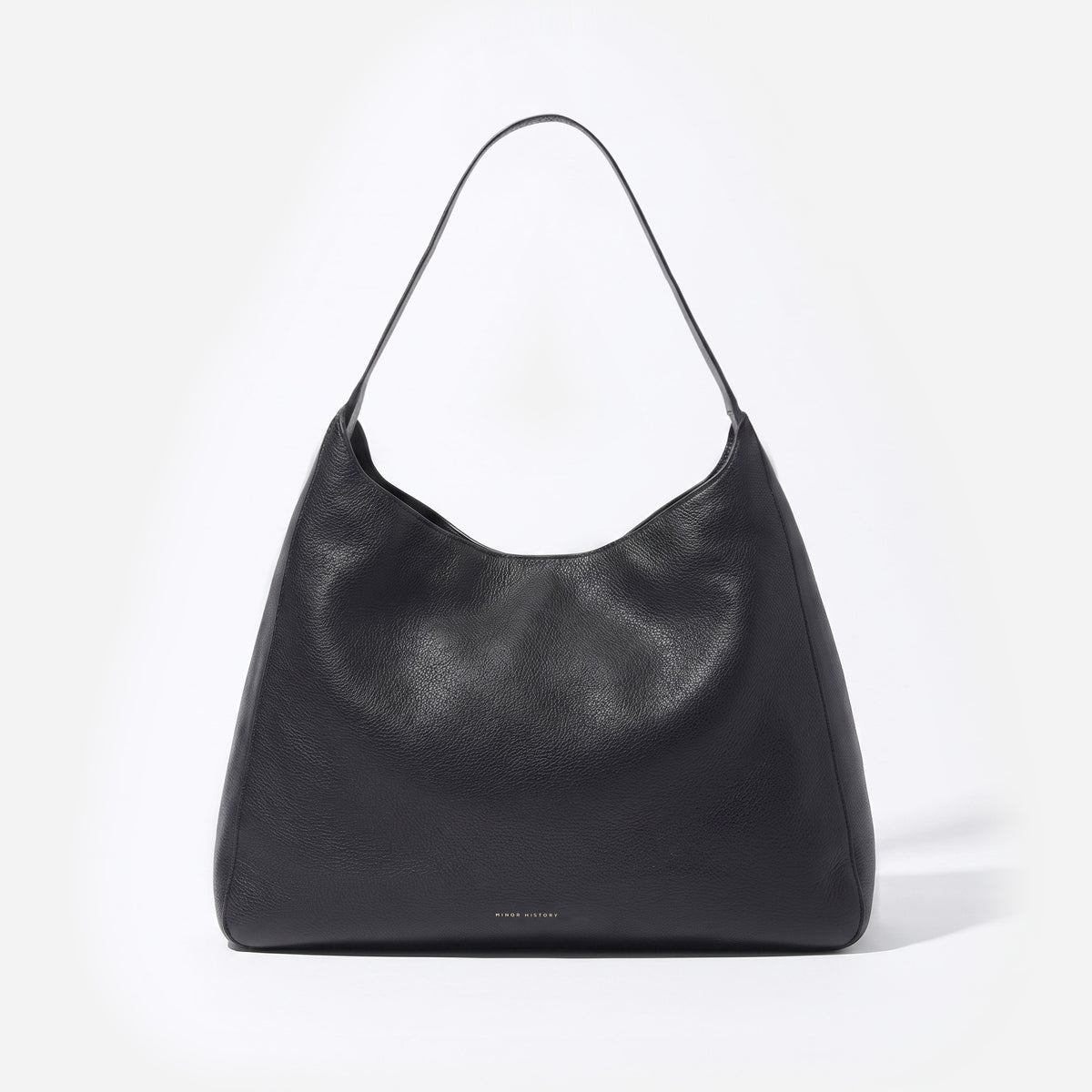 A black leather slouchy shoulder bag with a single strap, photographed against a clean white background. -Black