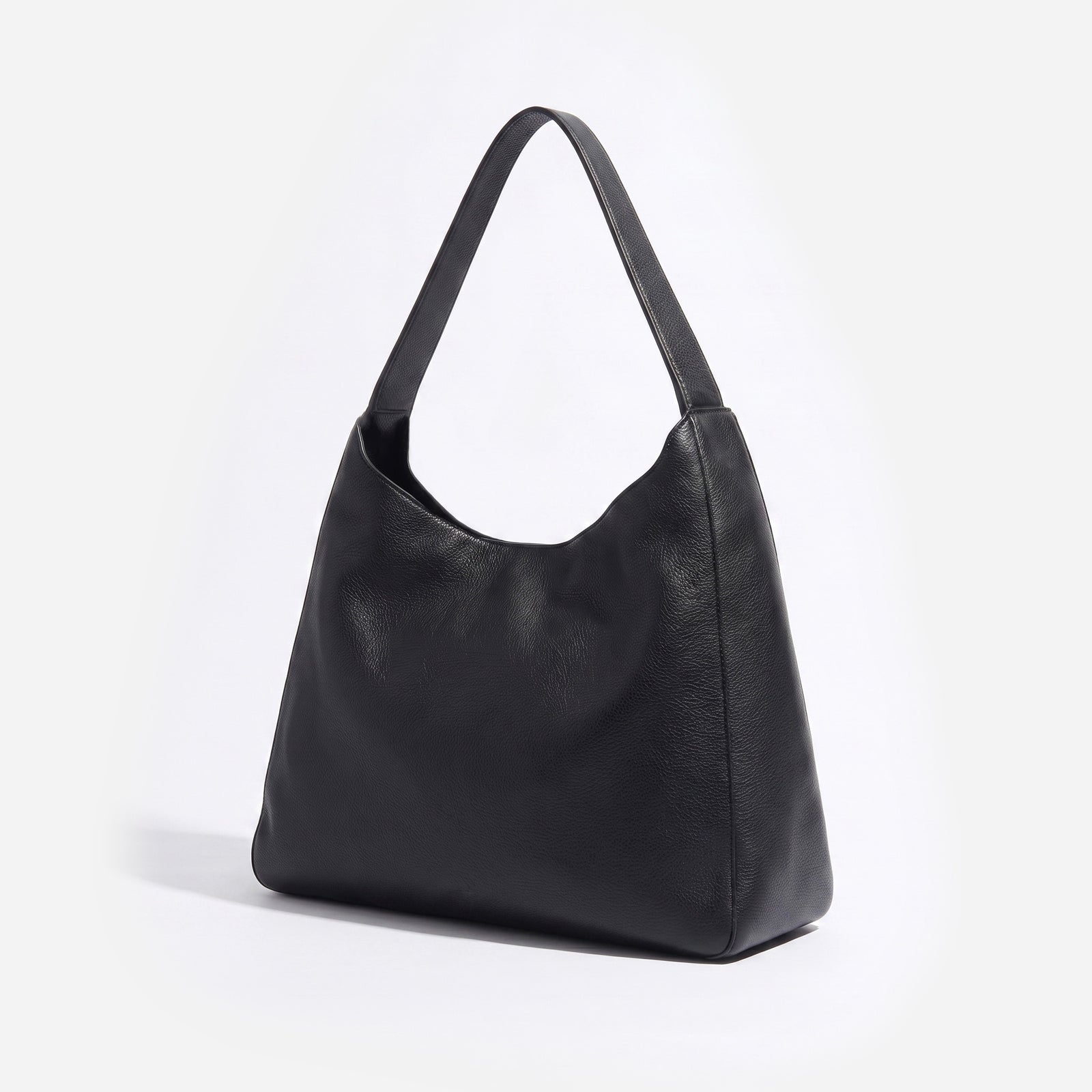 Black leather handbag on a white background - Black