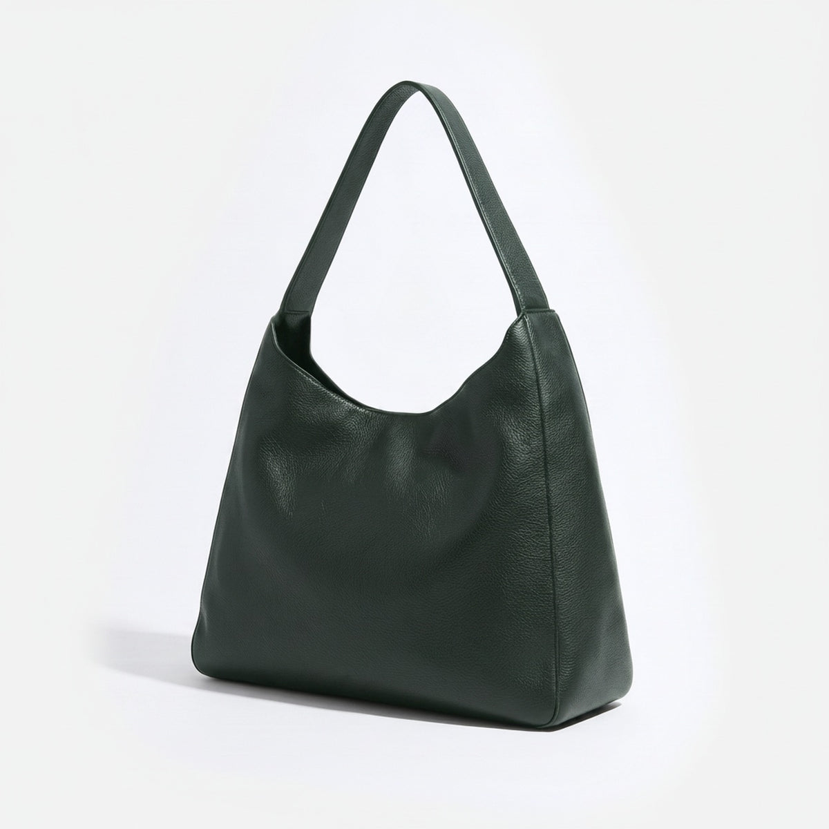 Green leather handbag on a white background -Evergreen