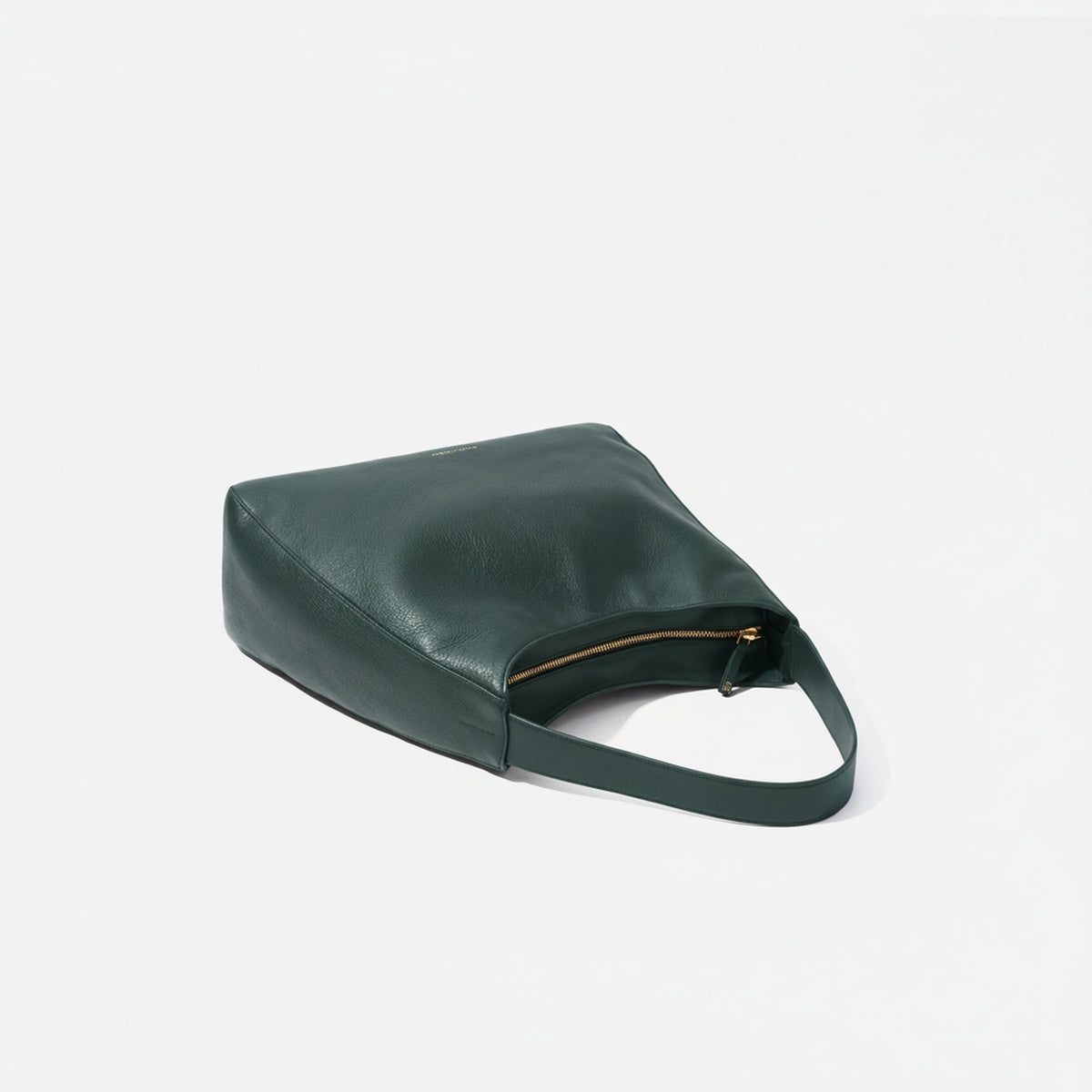Green handbag on a light gray background  -Evergreen